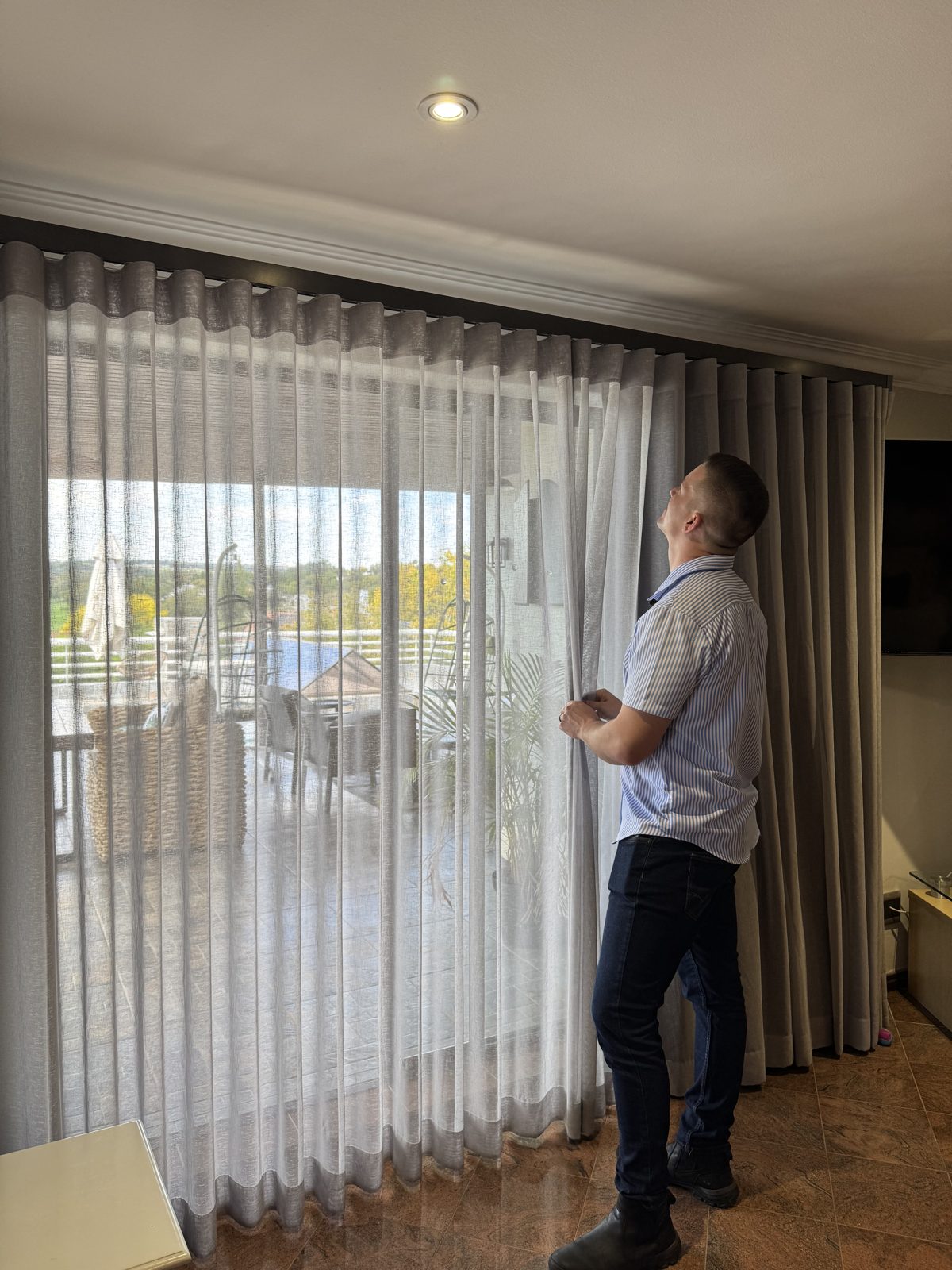 Wave curtains with sheer and blockout layers on a sliding door, installed by Blind Concepts in Johannesburg